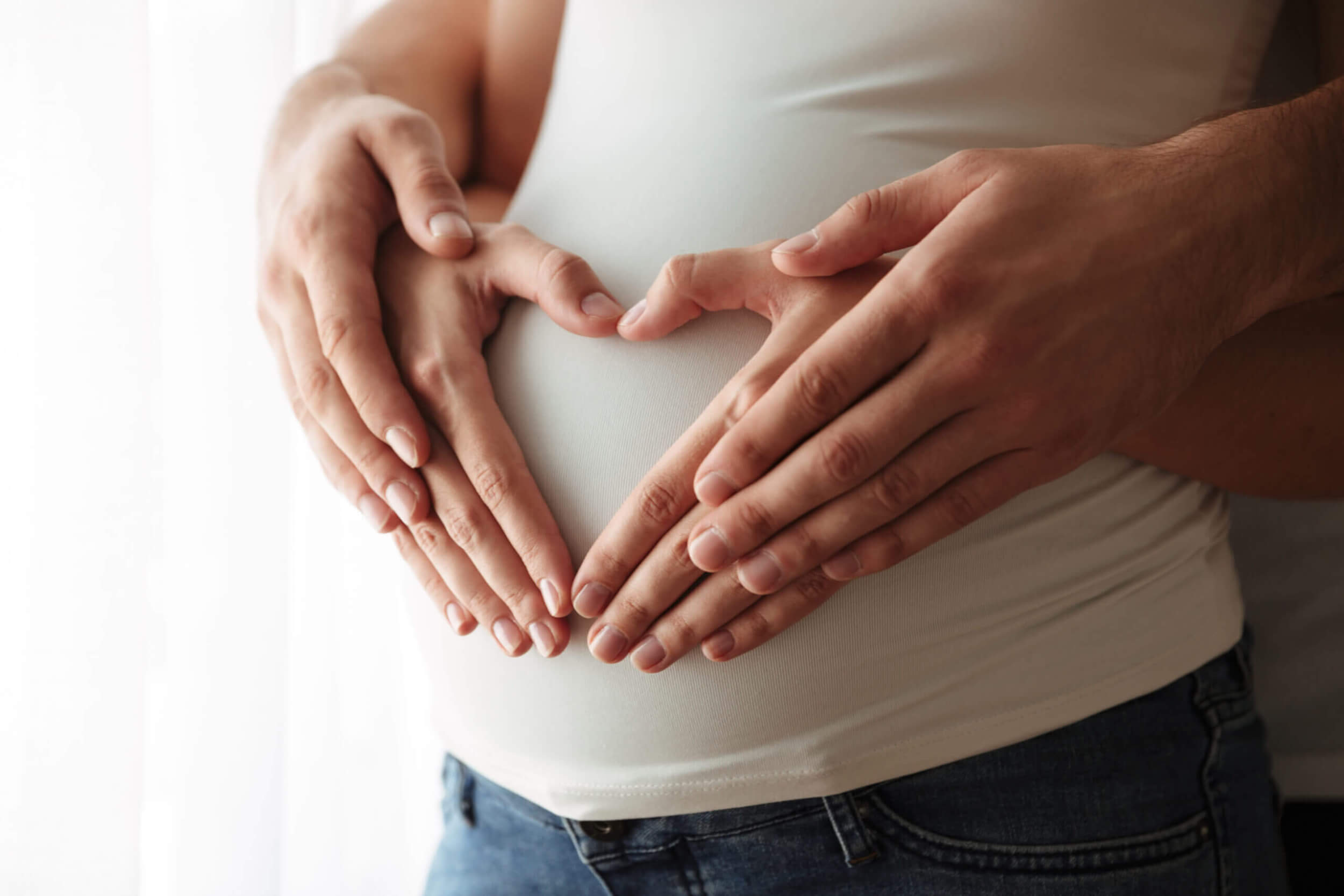 close up of hands on belly