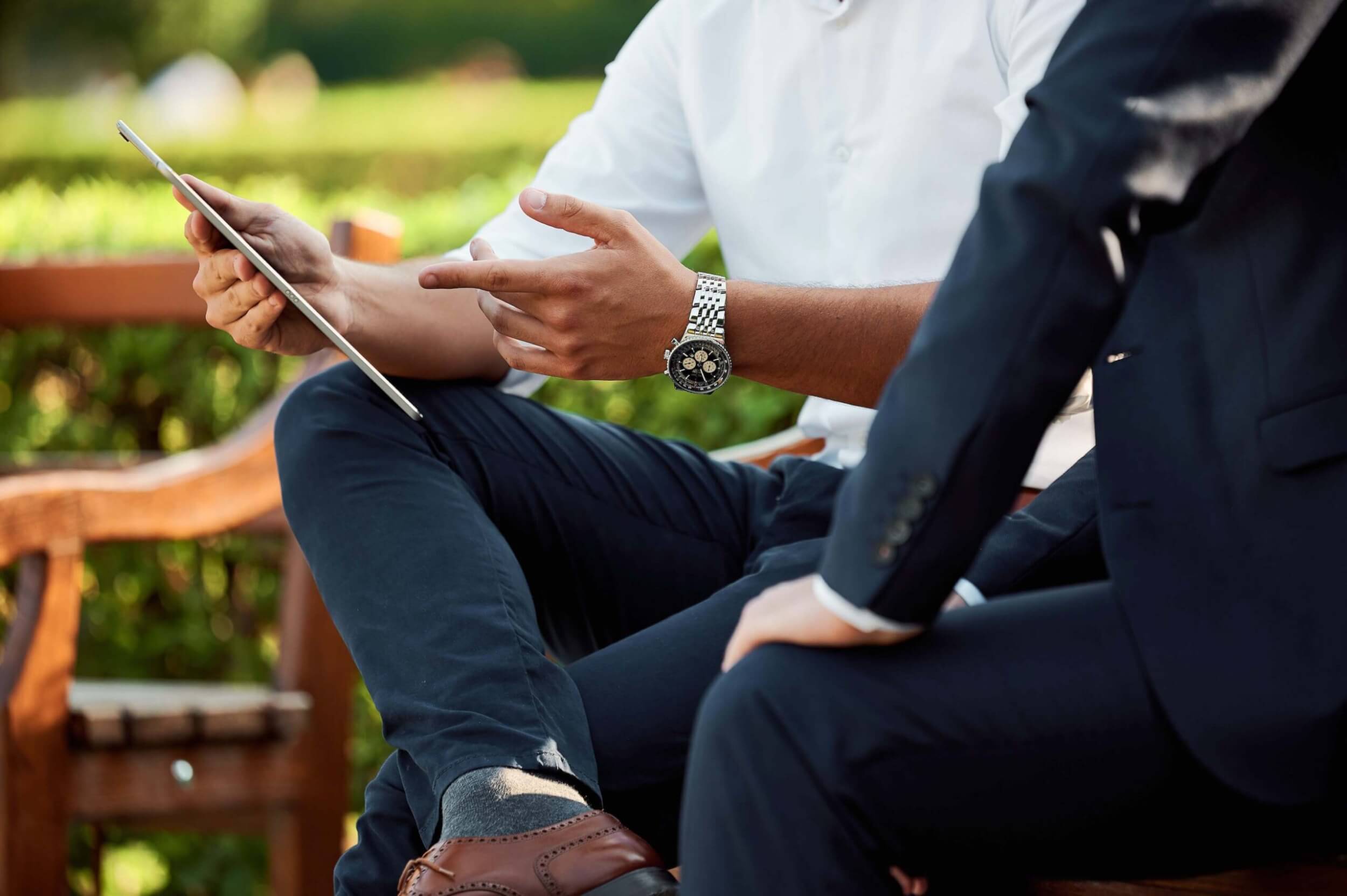holding-and-pointing-at-ipad-with-watch-on-wrist