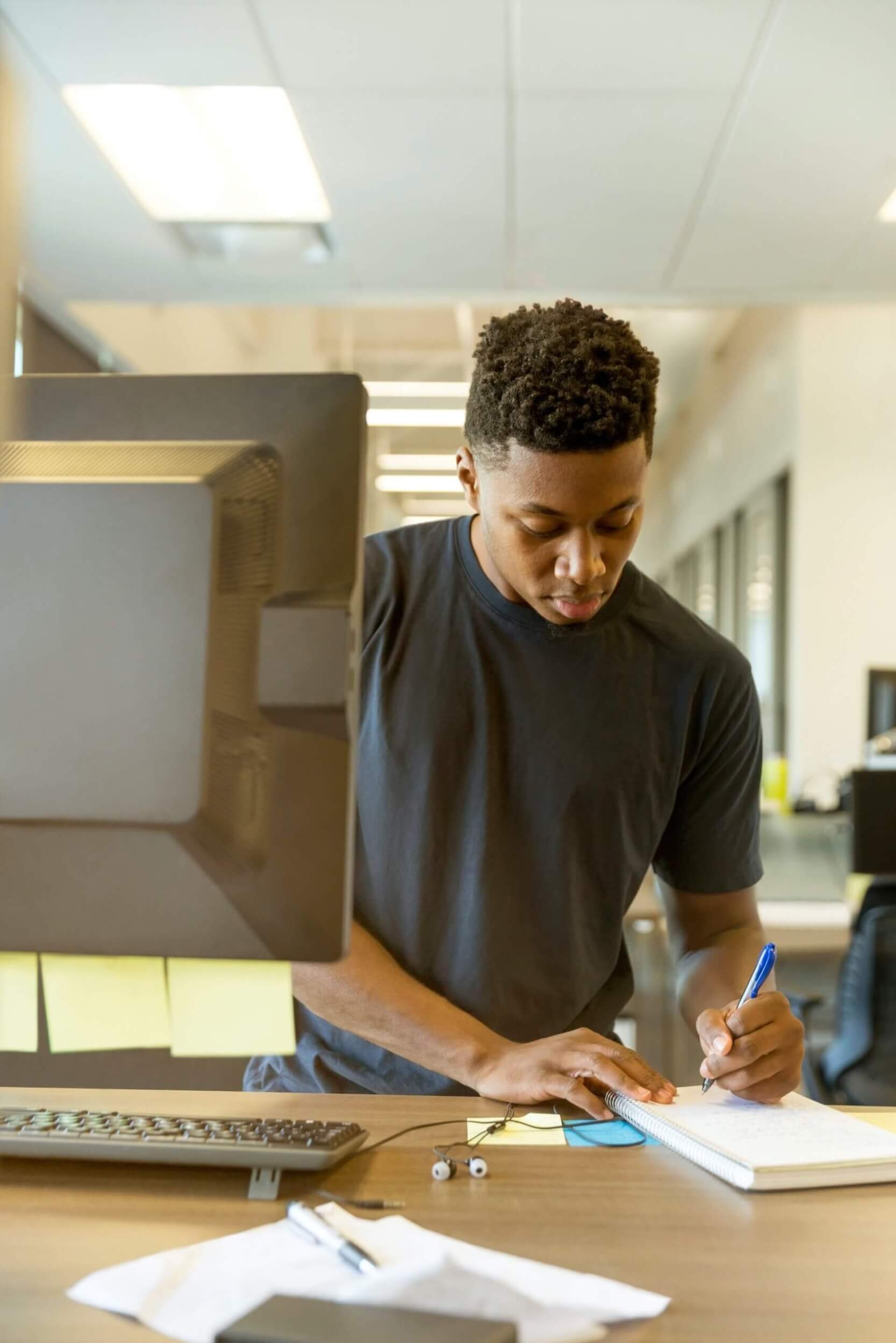 studying-at-computer-writing-notes